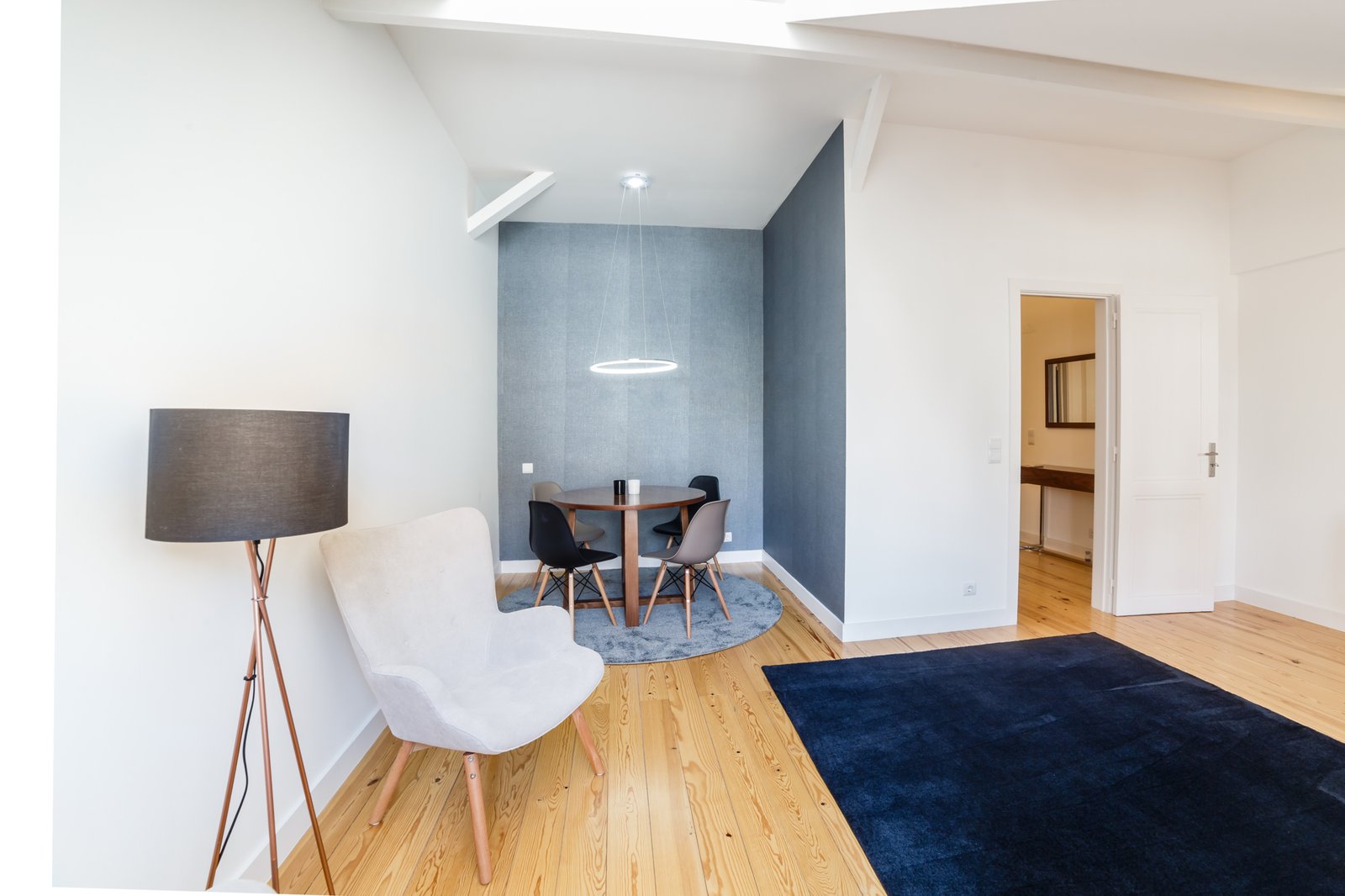 Modern apartment with white walls and light wooden floor